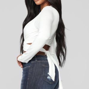 Long sleeve crop top with tie in the back.